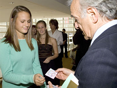 Professor Elie Wiesel accepts peace cards created by area students.
